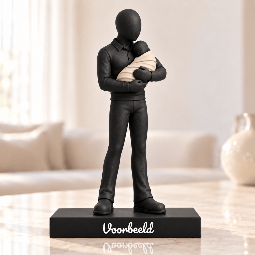 Flowman Man met baby – beeldje met persoonlijke tekst – Galaxy Black met crèmekleurige babydeken – conceptafbeelding