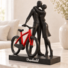 Galaxy Black Flowman omhelzing bij de fiets met rood fietsframe