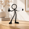 Stickyman Bedankt met leeg kaartje op een eiken kast in een licht interieur
