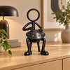Stickyman handpanspeler in warm interieur